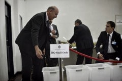 Gibraltar - 27th November 2015 - With security around John Macintosh Hall tightened, the first ballot box surprised everyone arriving dead on 10pm, the time polling stations were supposed to close their doors. A stream of ballot boxes then arrived as GBC announced the results of their exit poll putting the GSLP/Liberal Alliance ahead with 72%. As counting started by midnight candidates started to arrive at John Macintosh Hall where the count is taking place.One of the first candidates to arrive was John Cortes, followed by Edwin Reyes. Moments later Joseph Garcia, Gilbert Licudi, Albert Isola and Steven Linares arrived to a somewhat quite JHM as counting started.The verification count was overseen by agents of both parties, with the Governor Alison Macmilan also visiting JMH to oversee the protocols being followed, as is traditional during general elections in Gibraltar.John Macintosh Hall also saw tonight armed patrols present around the area, in keeping with the high security alert status presently experienced in Gibraltar. The security detail deployed included the presence of an inspector within the armed response detail, this being one of the few occassions in which a high ranking officer has been seen present as part of the unit when in public.