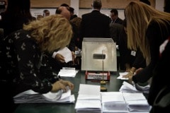 Gibraltar - 27th November 2015 - With security around John Macintosh Hall tightened, the first ballot box surprised everyone arriving dead on 10pm, the time polling stations were supposed to close their doors. A stream of ballot boxes then arrived as GBC announced the results of their exit poll putting the GSLP/Liberal Alliance ahead with 72%. As counting started by midnight candidates started to arrive at John Macintosh Hall where the count is taking place.One of the first candidates to arrive was John Cortes, followed by Edwin Reyes. Moments later Joseph Garcia, Gilbert Licudi, Albert Isola and Steven Linares arrived to a somewhat quite JHM as counting started.The verification count was overseen by agents of both parties, with the Governor Alison Macmilan also visiting JMH to oversee the protocols being followed, as is traditional during general elections in Gibraltar.John Macintosh Hall also saw tonight armed patrols present around the area, in keeping with the high security alert status presently experienced in Gibraltar. The security detail deployed included the presence of an inspector within the armed response detail, this being one of the few occassions in which a high ranking officer has been seen present as part of the unit when in public.